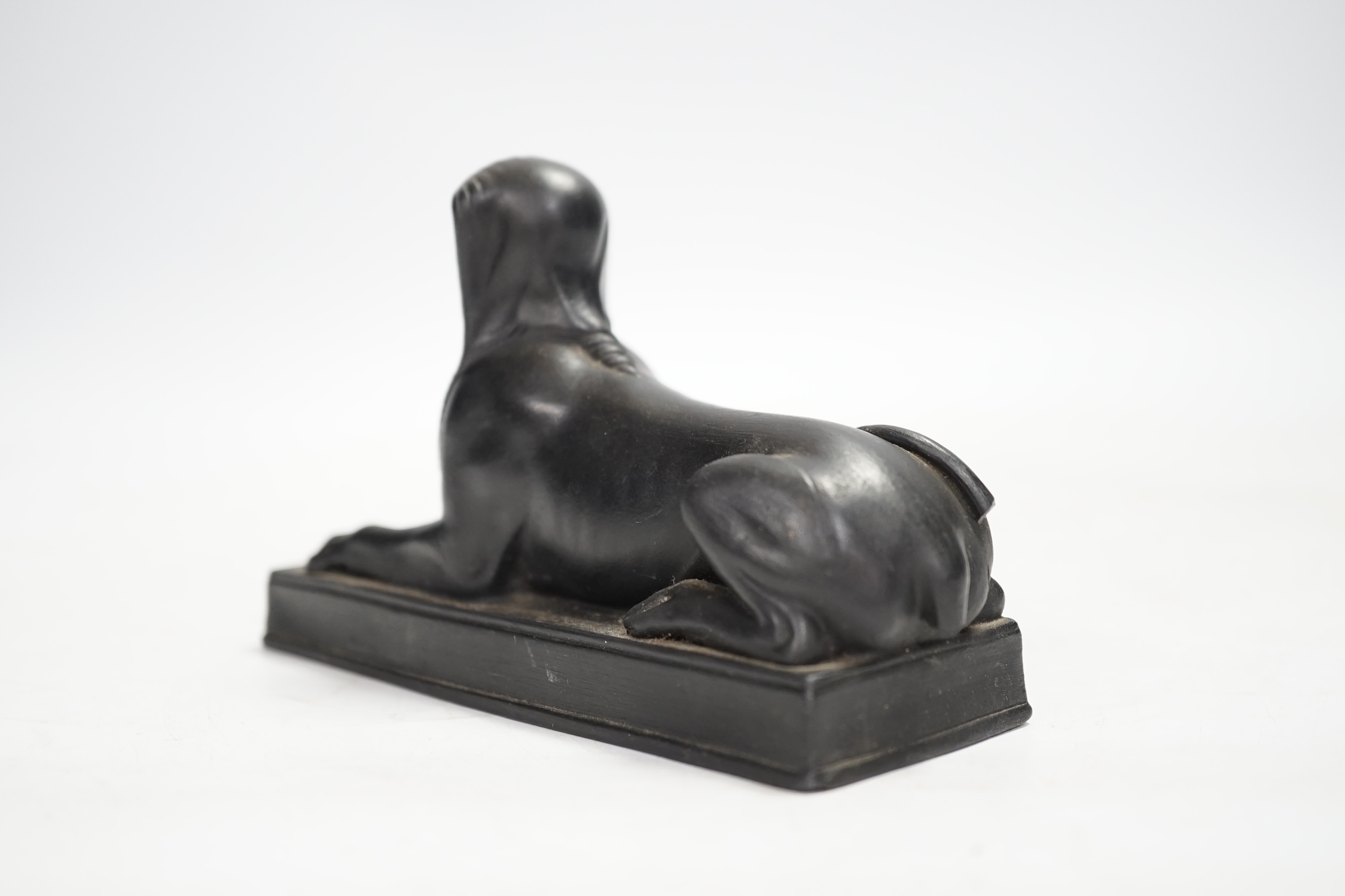 A 19th century Wedgwood basalt model of a sphinx. Condition - loss to tail, minor rubbing, fair